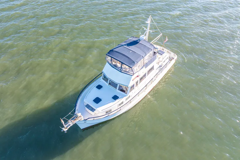 Slide: The Image of Aerial view of 1989 Grand Banks 46 Classic yacht cruising on open water. - 7