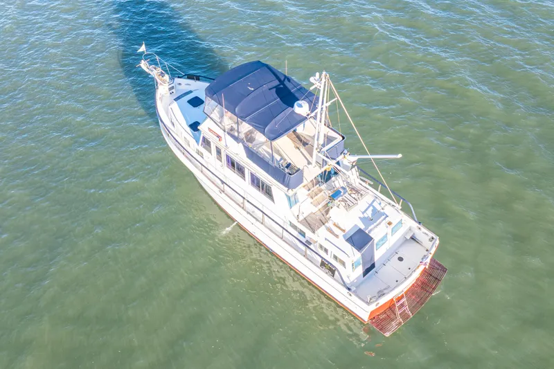 Slide: The Image of Aerial view of 1989 Grand Banks 46 Classic yacht on calm water. - 9