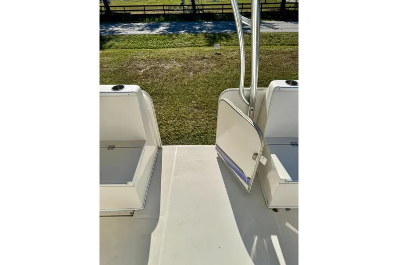 Slide: The Image of 2017 Beachcat 230 boat interior with open door and seating area. - 13