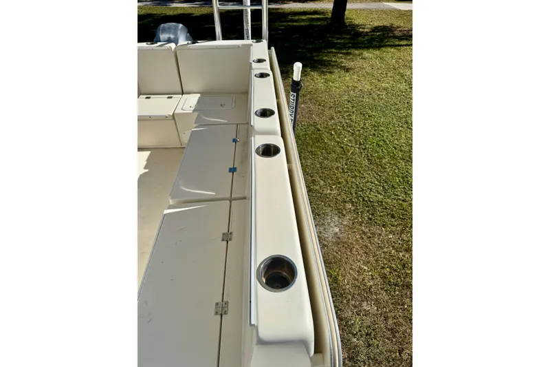 Slide: The Image of 2017 Beachcat 230 boat interior with seating and cup holders, viewed from above. - 15