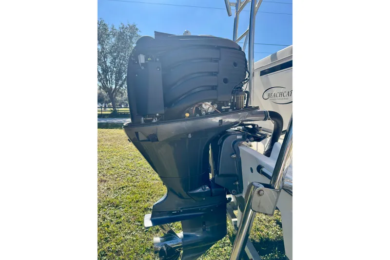 Slide: The Image of Outboard motor on a 2017 Beachcat 230 boat, sunny day background. - 20