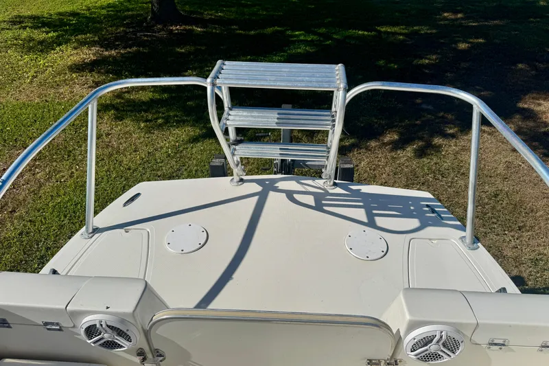 Slide: The Image of Rear view of a 2017 Beachcat 230 boat with metal ladder and speakers. - 6
