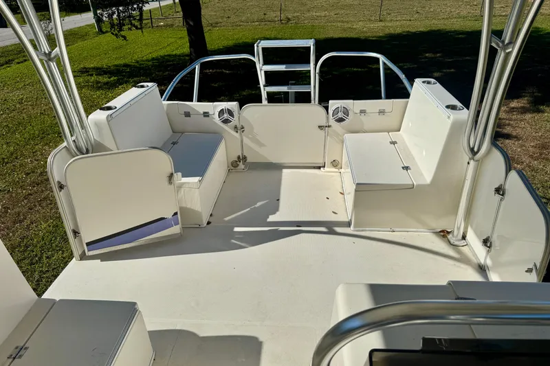 Slide: The Image of 2017 Beachcat 230 boat interior with seating and storage compartments. - 7