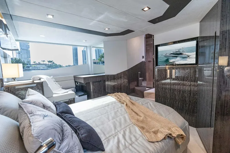 Slide: The Image of Luxurious 2021 Galeon 500 Fly yacht bedroom with modern decor and city view. - 3