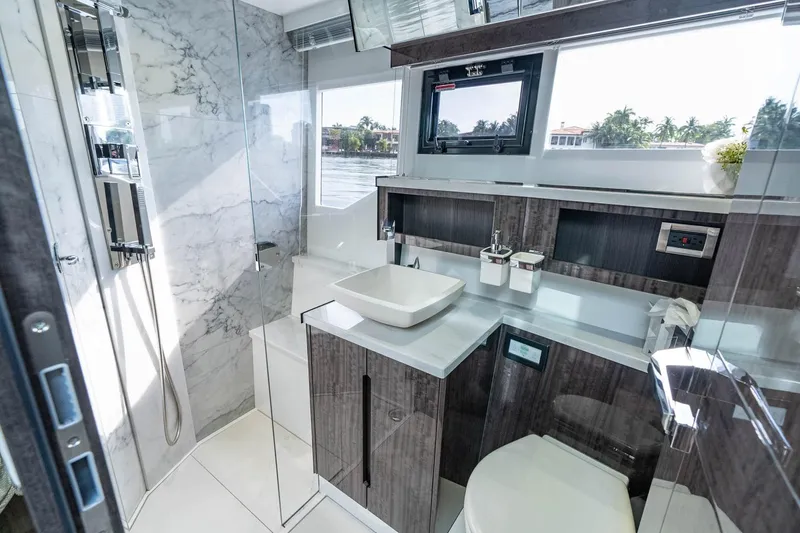 Slide: The Image of Luxurious bathroom interior of 2021 Galeon 500 Fly yacht with modern fixtures and marble accents. - 4