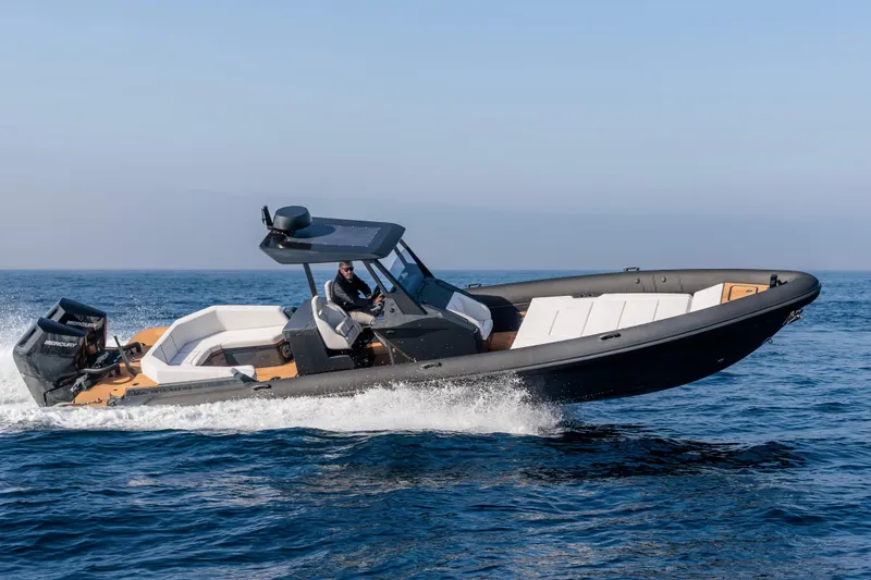 Slide: The Image of 2026 Rock Marine RM 36 speedboat cruising on open water, showcasing sleek design and performance. - 10
