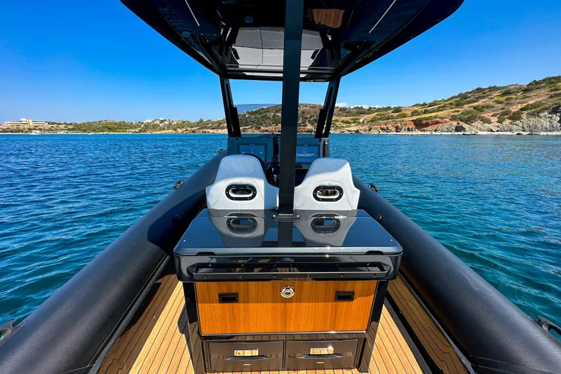 Slide: The Image of 2026 Rock Marine RM 36 boat interior with sleek design on clear blue water. - 18