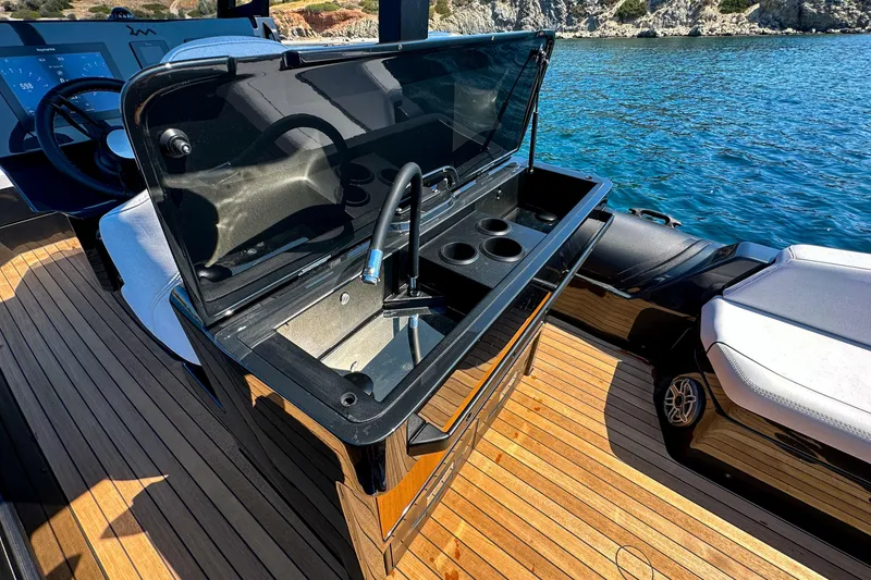 Slide: The Image of Luxury yacht RM 36 by Rock Marine, featuring a sleek onboard sink and wooden deck, 2026 model. - 19