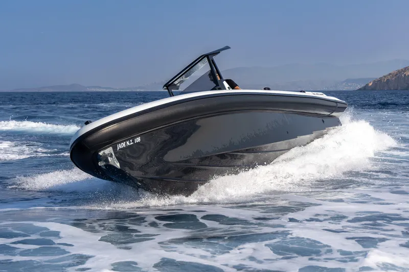 Slide: The Image of 2026 Rock Marine RM 36 boat cruising on open sea with waves. - 2