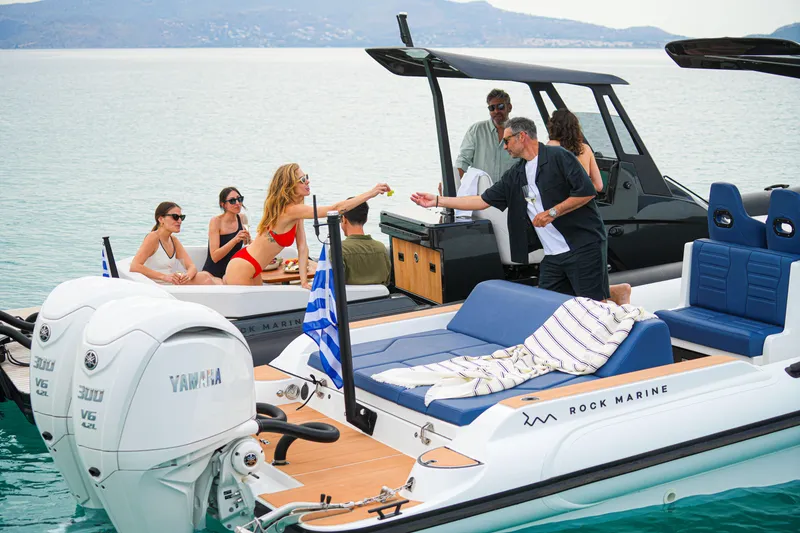 Slide: The Image of People enjoying a day on a 2026 Rock Marine RM 36 boat, with Yamaha engines. - 21