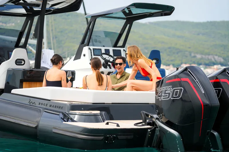 Slide: The Image of Group enjoying on a 2026 Rock Marine RM 36 boat with powerful engines. - 22
