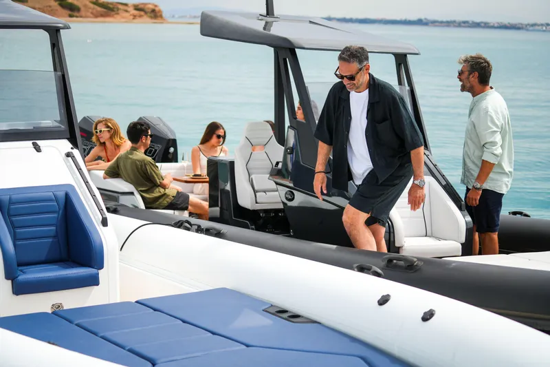 Slide: The Image of People enjoying a day on a 2026 Rock Marine RM 36 boat. - 23