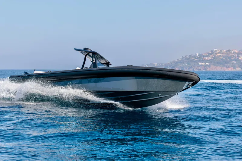 Slide: The Image of 2026 Rock Marine RM 36 boat cruising on open water, coastal background. - 3