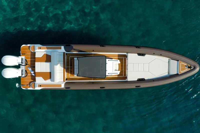 Slide: The Image of Aerial view of 2026 Rock Marine RM 36 boat on clear blue water. - 4