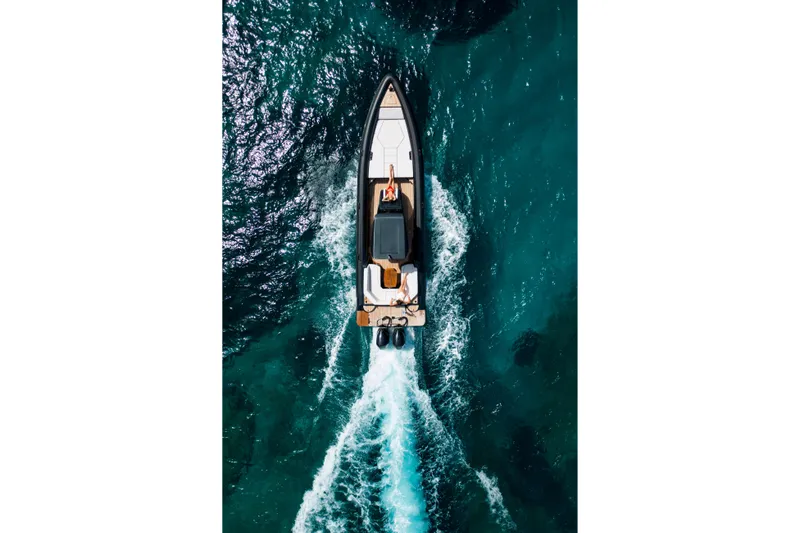 Slide: The Image of Aerial view of 2026 Rock Marine RM 36 yacht cruising in clear blue waters. - 6