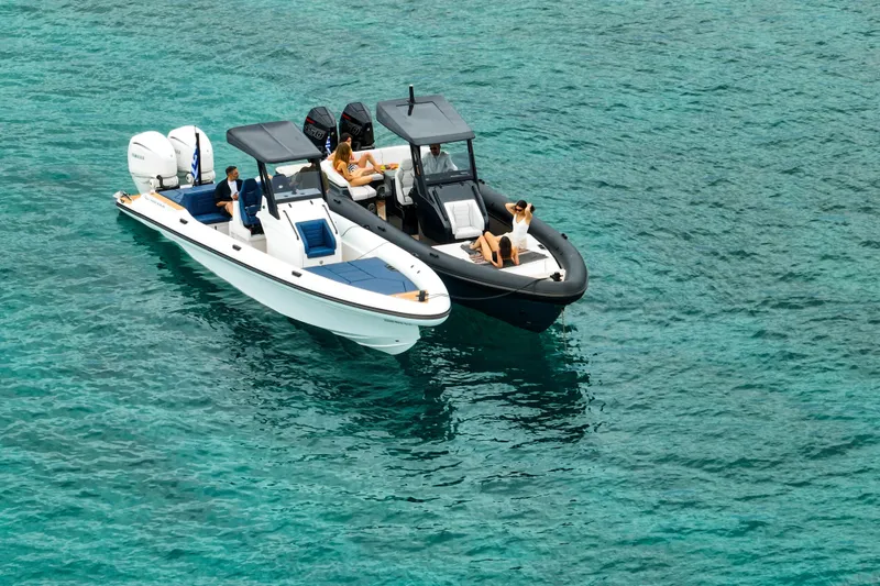Slide: The Image of Two Rock Marine RM 36 boats, 2026 model, floating on clear turquoise water. - 9