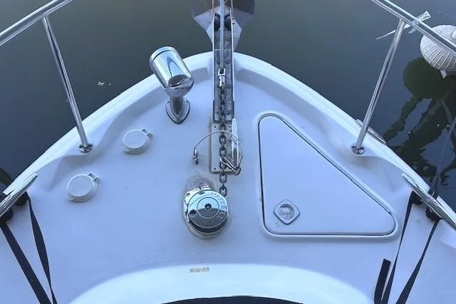 Slide: The Image of Bow of 2001 Sea Ray 340 Sundancer with anchor and deck fittings. - 11