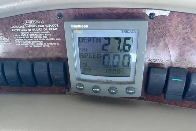 Slide: The Image of Raytheon Tridata display on 2001 Sea Ray 340 Sundancer showing depth and speed readings. - 14