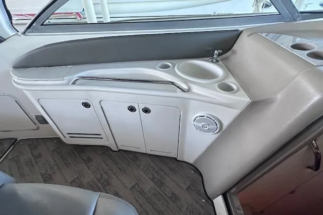 Slide: The Image of 2001 Sea Ray 340 Sundancer interior with sink, storage cabinets, and cup holders. - 17