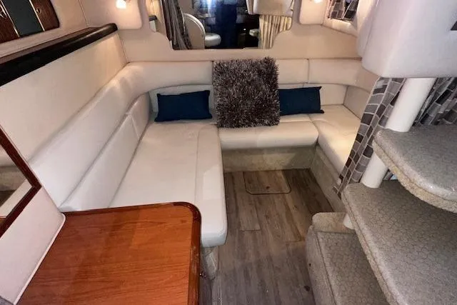 Slide: The Image of 2001 Sea Ray 340 Sundancer interior with plush seating and modern decor. - 23