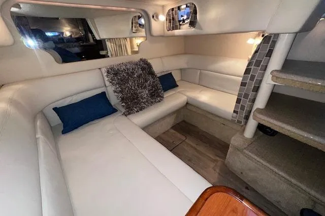 Slide: The Image of Luxurious interior of 2001 Sea Ray 340 Sundancer with plush seating and modern decor. - 24