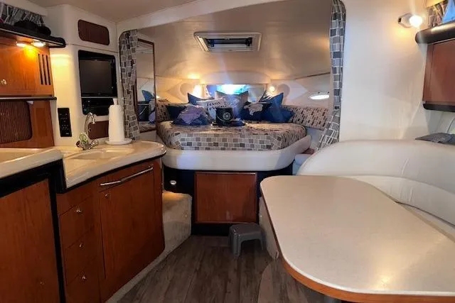 Slide: The Image of Interior of 2001 Sea Ray 340 Sundancer yacht with cozy cabin and modern amenities. - 25