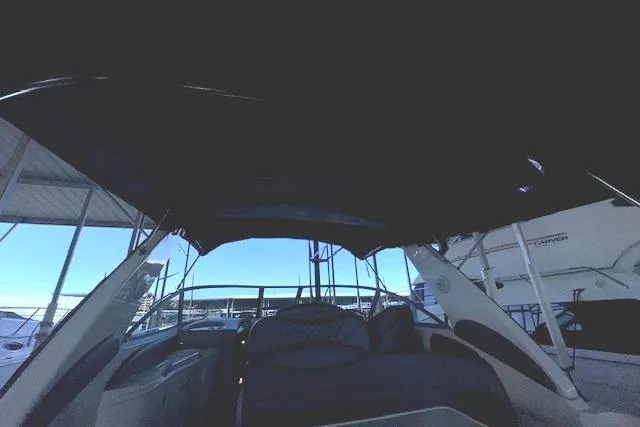 Slide: The Image of 2001 Sea Ray 340 Sundancer interior view with covered seating area. - 28