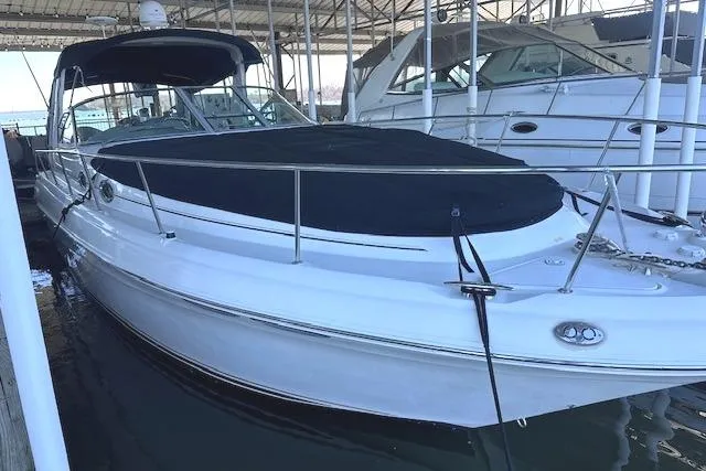 Slide: The Image of 2001 Sea Ray 340 Sundancer boat docked in marina, covered and sheltered. - 3