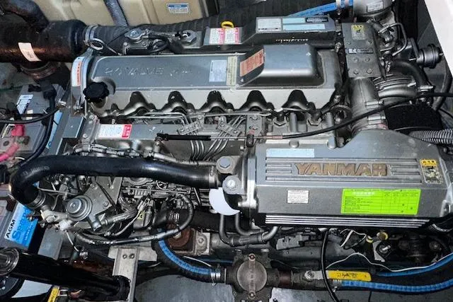 Slide: The Image of Engine of a 2001 Sea Ray 340 Sundancer boat, featuring Yanmar components. - 31