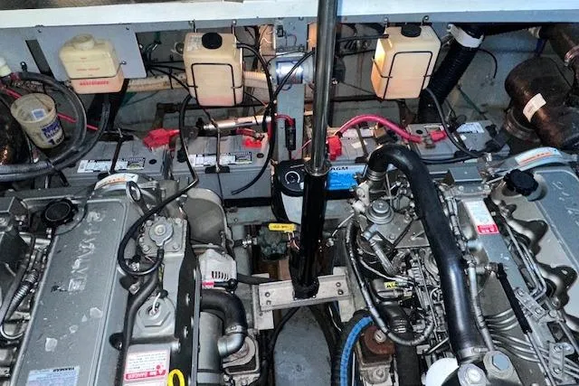 Slide: The Image of Engine room of a 2001 Sea Ray 340 Sundancer with visible components and wiring. - 32
