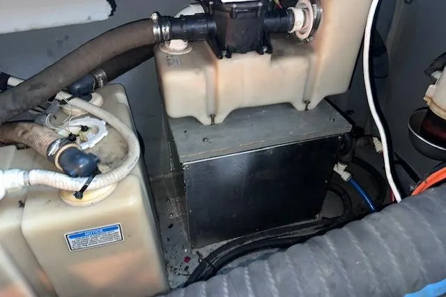 Slide: The Image of Engine compartment of a 2001 Sea Ray 340 Sundancer, showing tanks and hoses. - 37