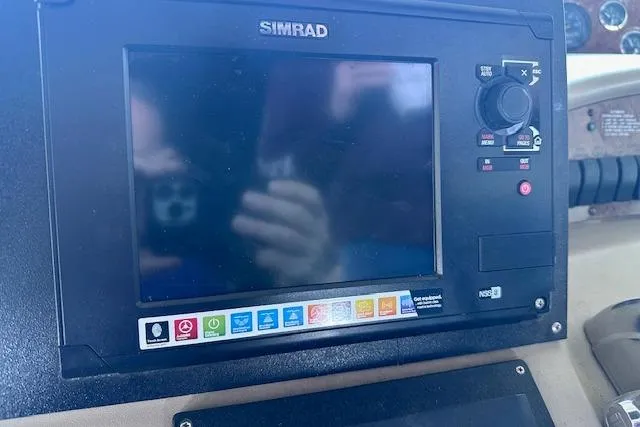 Slide: The Image of Simrad navigation system on 2001 Sea Ray 340 Sundancer boat dashboard. - 38
