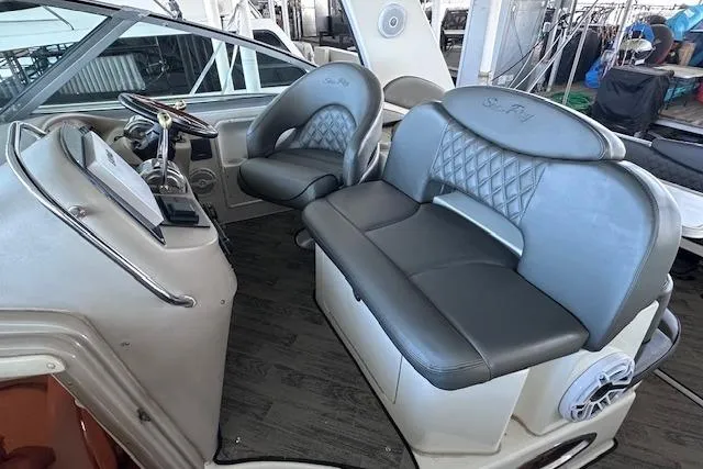 Slide: The Image of 2001 Sea Ray 340 Sundancer cockpit with leather seating and modern controls. - 8