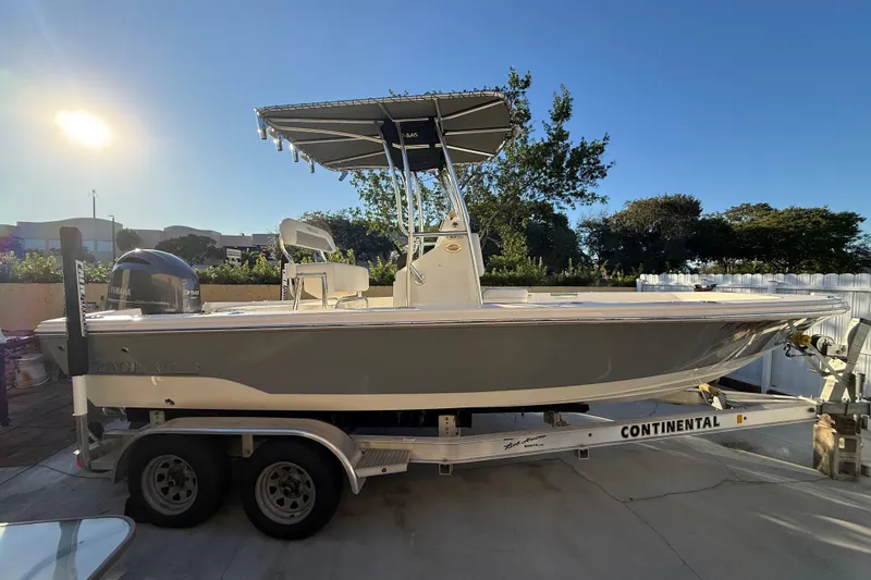 The Image of Pathfinder 2005 TRS boat on trailer, sunny day, outdoor setting, 2022 model. - 1