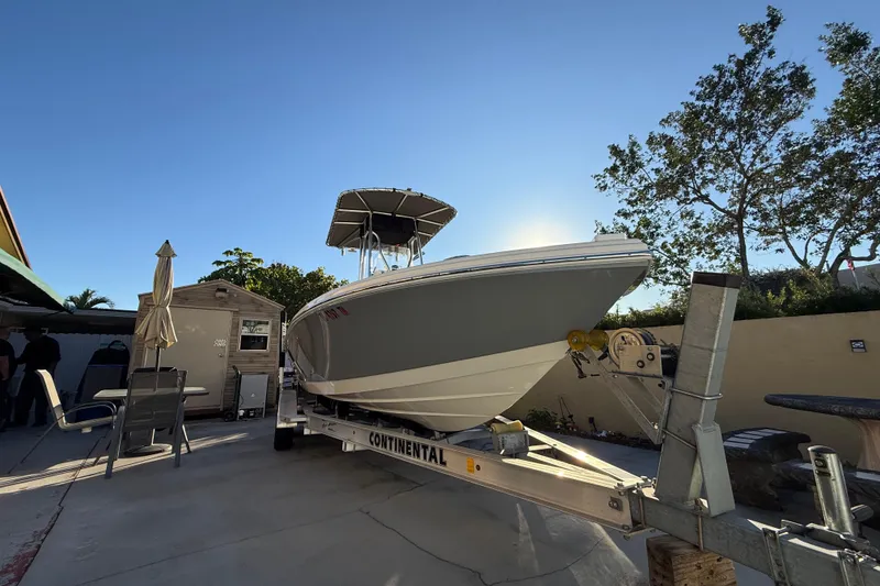 Slide: The Image of Pathfinder 2005 TRS boat on trailer, sunny day, outdoor setting, 2022 model. - 10