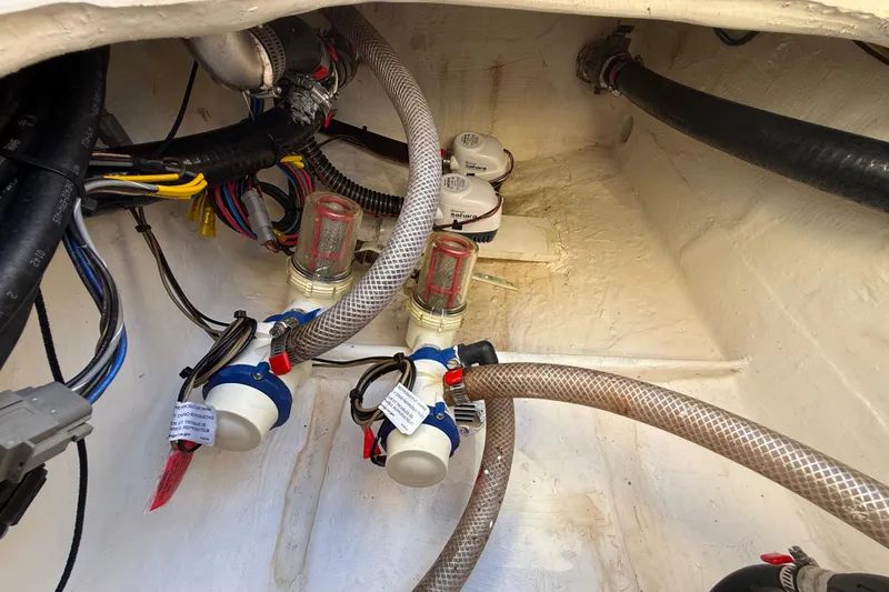 Slide: The Image of Bilge area of 2022 Pathfinder 2005 TRS boat with hoses and wiring. - 100