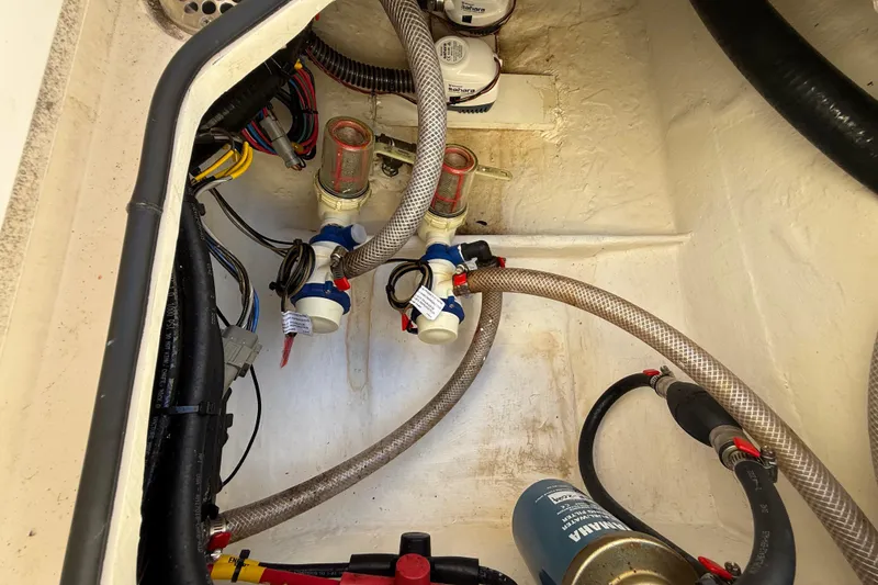 Slide: The Image of Boat engine compartment with wiring and hoses, Pathfinder 2005 TRS, 2022 model. - 103