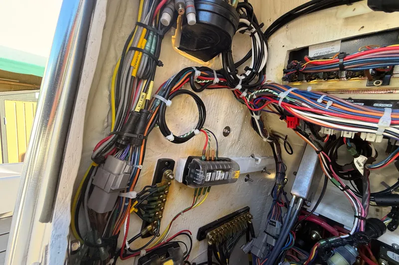 Slide: The Image of Electrical wiring inside a 2022 Pathfinder 2005 TRS boat, showcasing complex cable arrangement. - 108