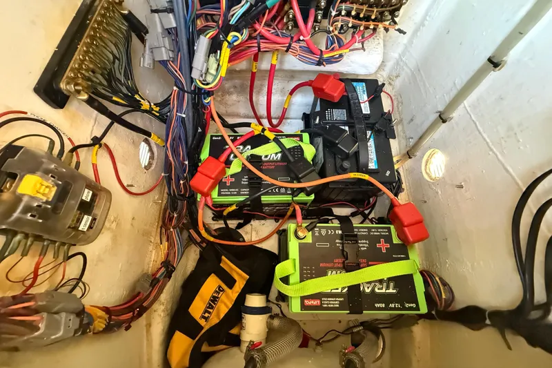 Slide: The Image of Electrical wiring and batteries in a 2005 Pathfinder TRS boat, model year 2022. - 111