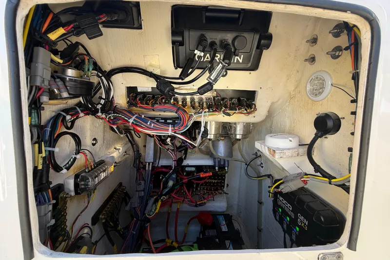 Slide: The Image of Electrical wiring and components inside a 2022 Pathfinder 2005 TRS boat compartment. - 112