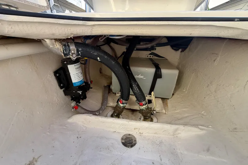 Slide: The Image of Bilge area of 2022 Pathfinder 2005 TRS boat with pump and hoses. - 114