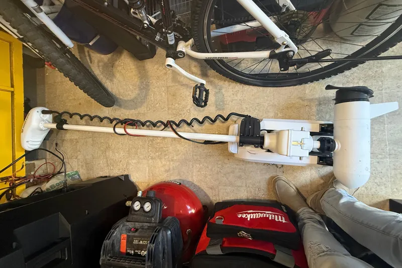 Slide: The Image of Pathfinder 2005 TRS motor in garage with bicycle and tools, 2022 model. - 115