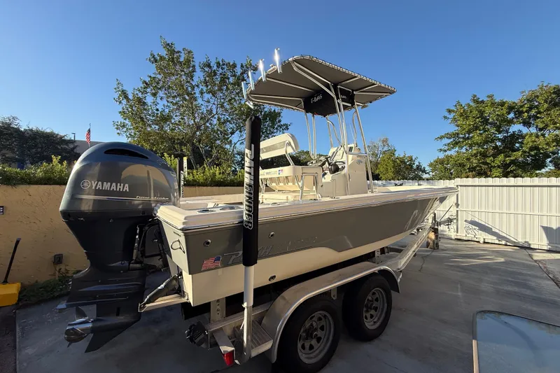 Slide: The Image of Pathfinder 2005 TRS boat with Yamaha engine on trailer, sunny day, 2022 model. - 14