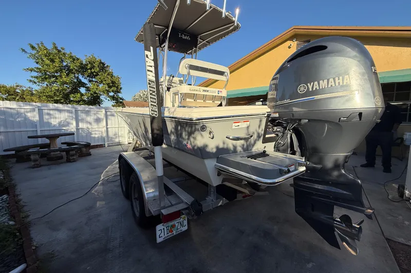 Slide: The Image of Pathfinder 2005 TRS boat with Yamaha engine on trailer, parked in driveway. - 17