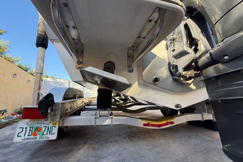 Slide: The Image of Rear view of a 2022 Pathfinder 2005 TRS boat on a trailer with Florida license plate. - 28