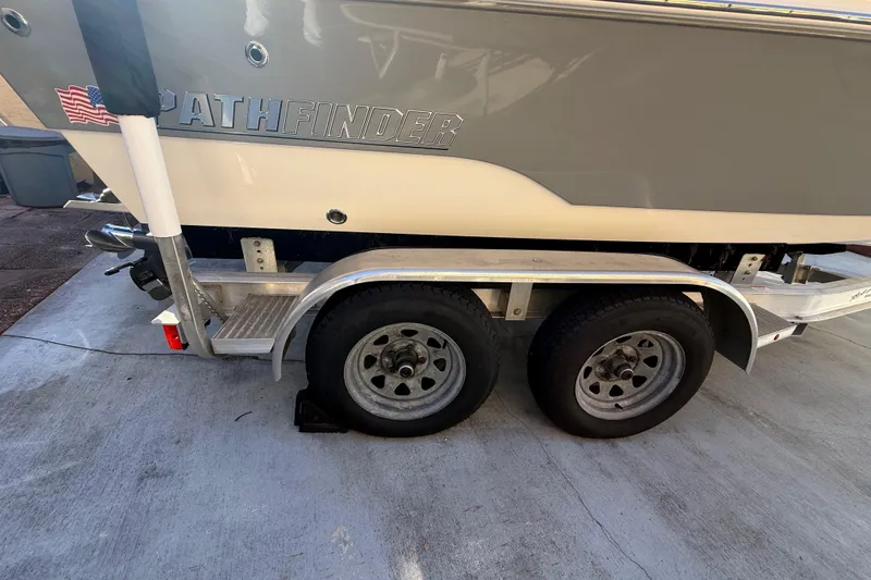 Slide: The Image of Pathfinder 2005 TRS boat on trailer, dual wheels, American flag sticker, 2022 model. - 30
