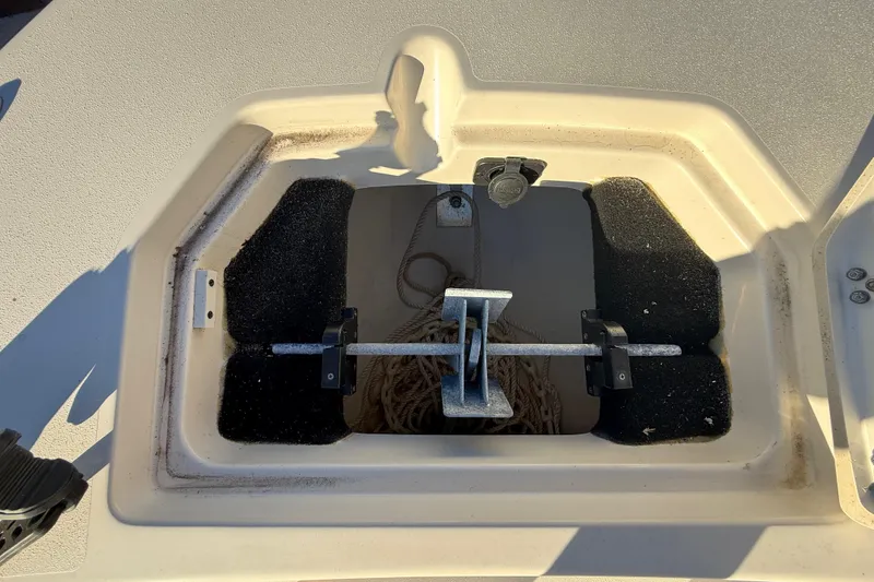 Slide: The Image of Anchor storage compartment on a 2022 Pathfinder 2005 TRS boat, featuring rope and secure fittings. - 31
