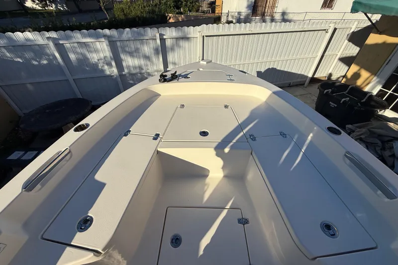 Slide: The Image of 2005 Pathfinder TRS boat deck with storage compartments, photographed in 2022. - 32