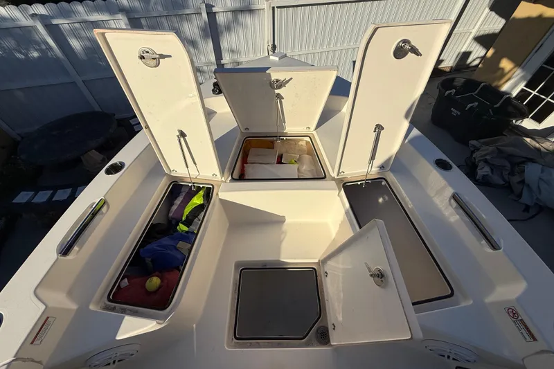 Slide: The Image of Open storage compartments on a 2022 Pathfinder 2005 TRS boat deck. - 33