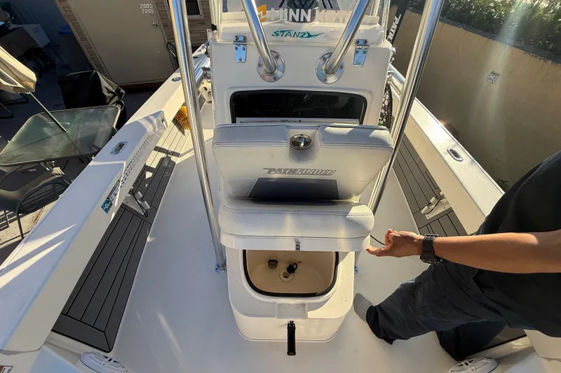 Slide: The Image of 2005 Pathfinder TRS boat interior with open storage compartment, viewed from above. - 36